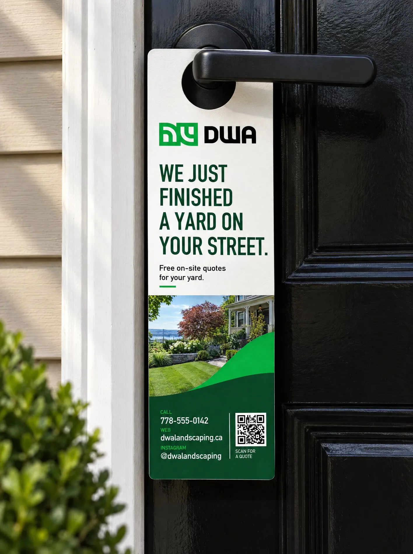 DWA Landscaping door hanger hanging on a black front door handle