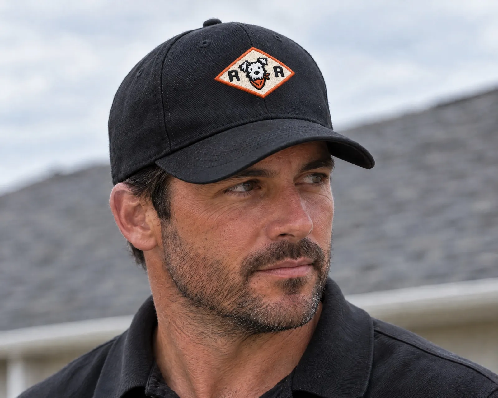 Rocco's Roofing dog badge embroidered on a black cap